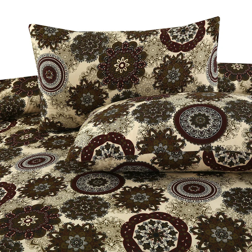 Floral patterned bedding set with pillows on a white background