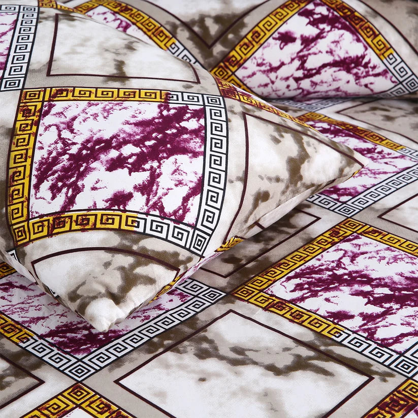 Decorative pillows with marble pattern and geometric border on a matching fabric background