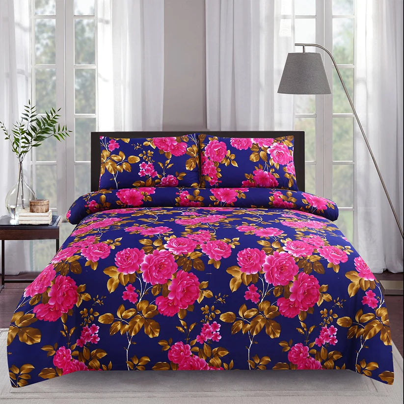 Floral bedding set with pink flowers on a blue background in a bedroom setting.