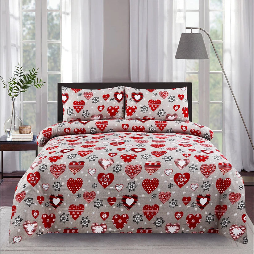 Heart-patterned bedding set on a bed in a bedroom with curtains and a lamp.