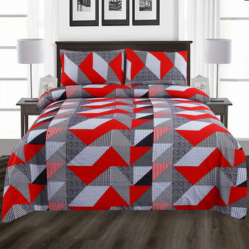 Geometric patterned quilt set on a bed in a bedroom setting