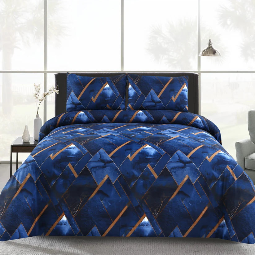 Blue geometric patterned comforter set on a bed in a modern bedroom.