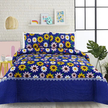 Floral patterned bedspread with matching pillows on a bed in a room setting.