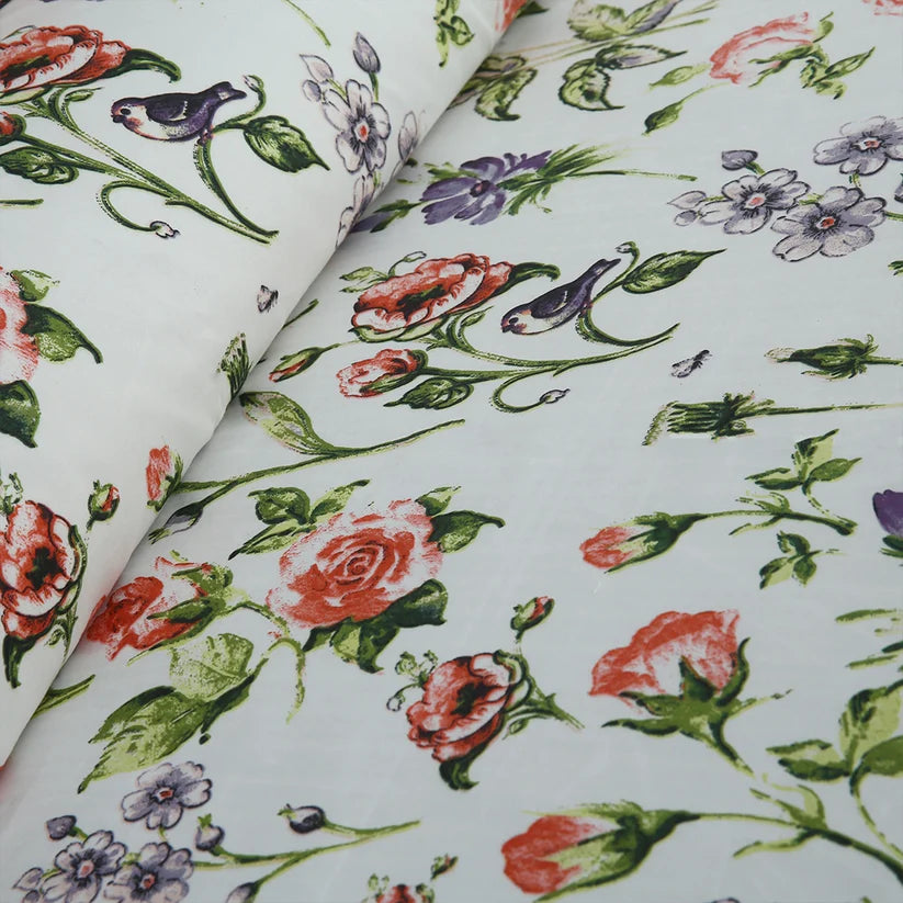 Floral bedding set on a bed in a bedroom setting