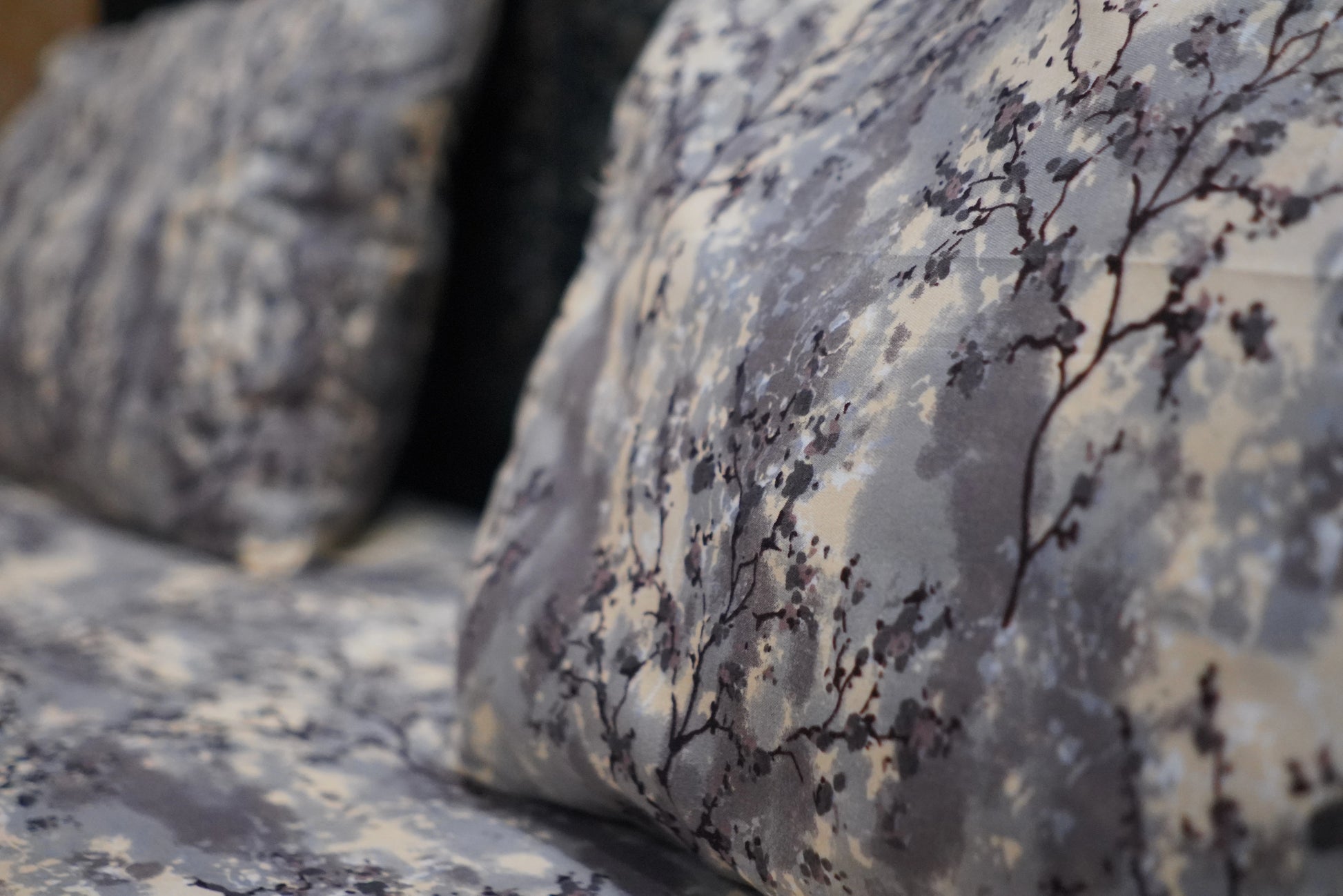 Close-up of a textured fabric with a branch pattern