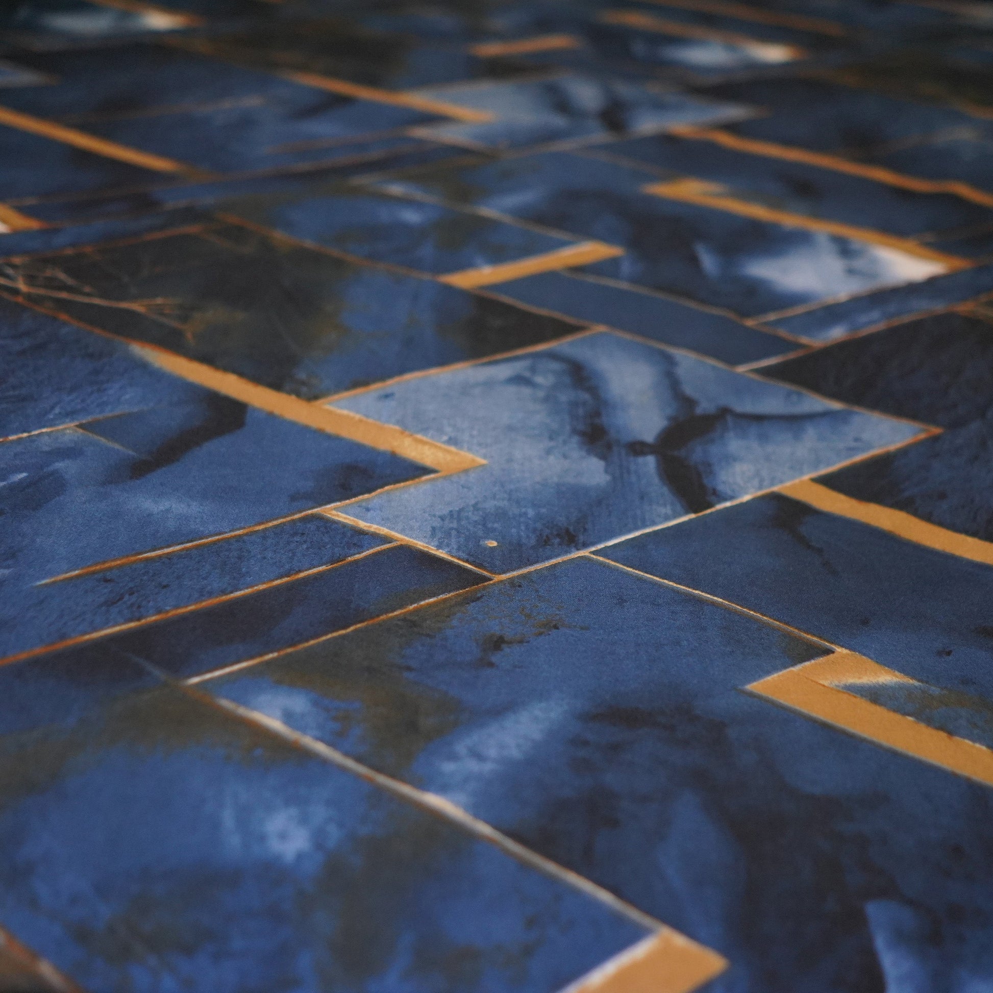 Close-up of blue and gold tiled floor