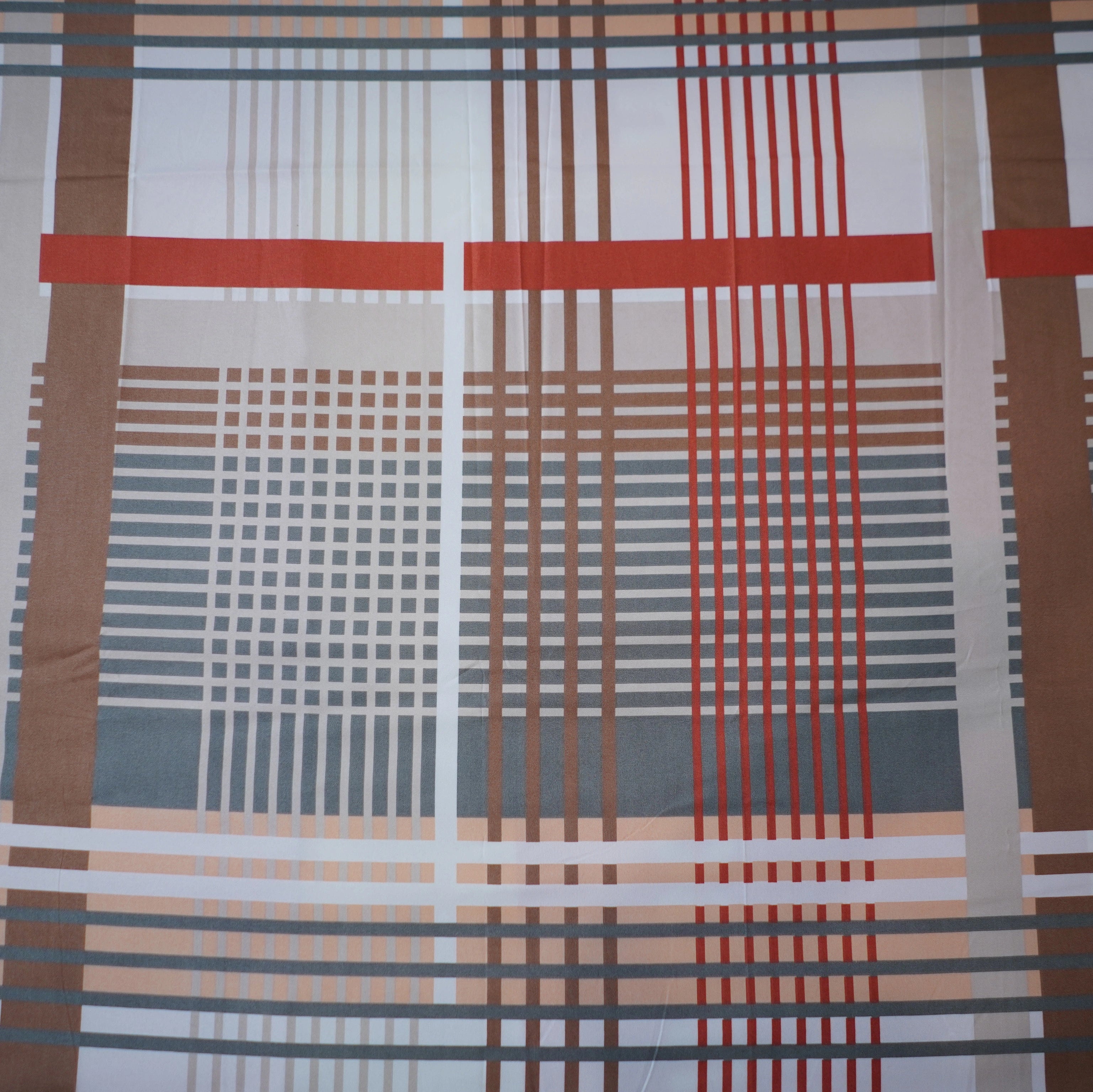 Plaid fabric with red, brown, and gray pattern