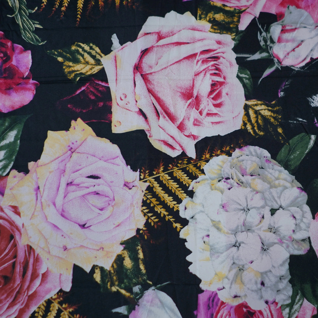 Floral bedding set on a bed with a modern room background