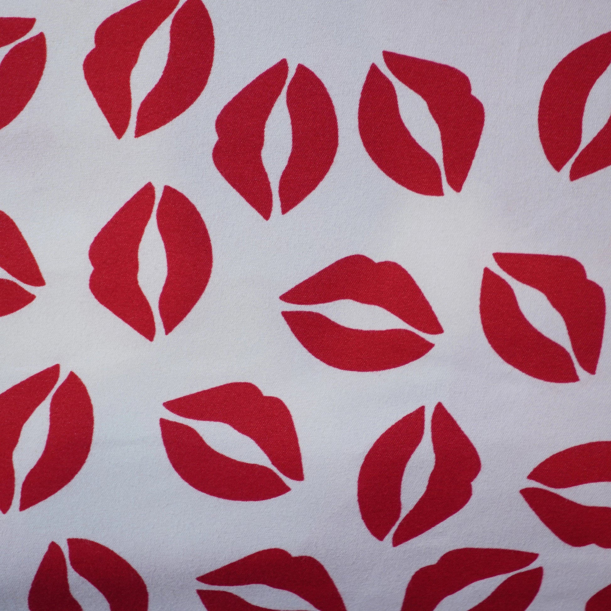 Pattern of red lips on a white background