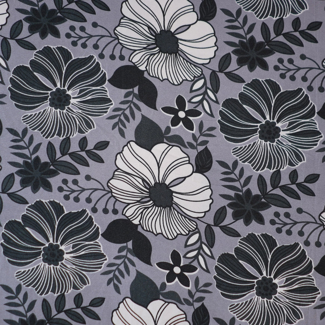 Floral patterned bedding set on a bed in a bedroom setting.