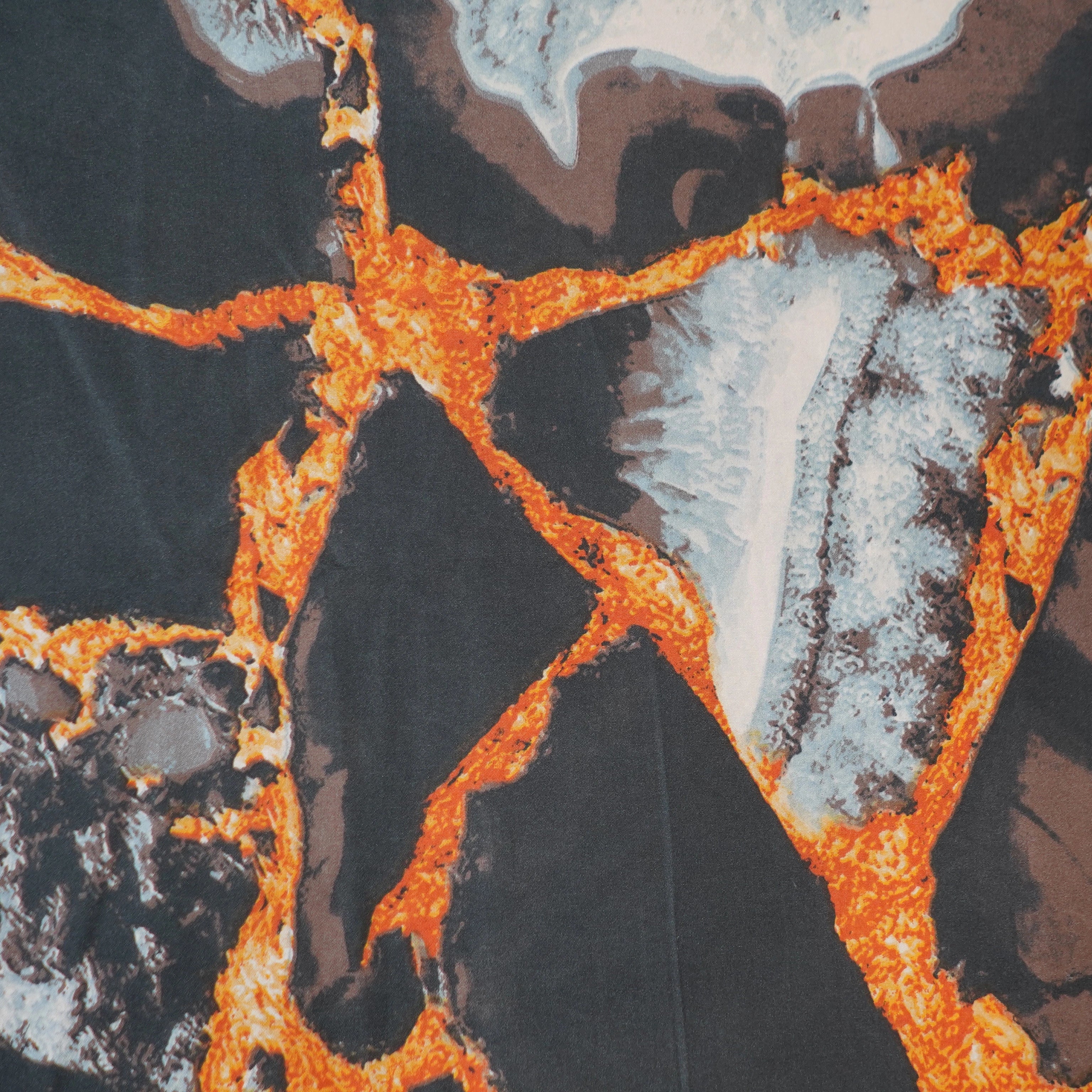 Close-up of a textured surface with orange, brown, and gray patterns