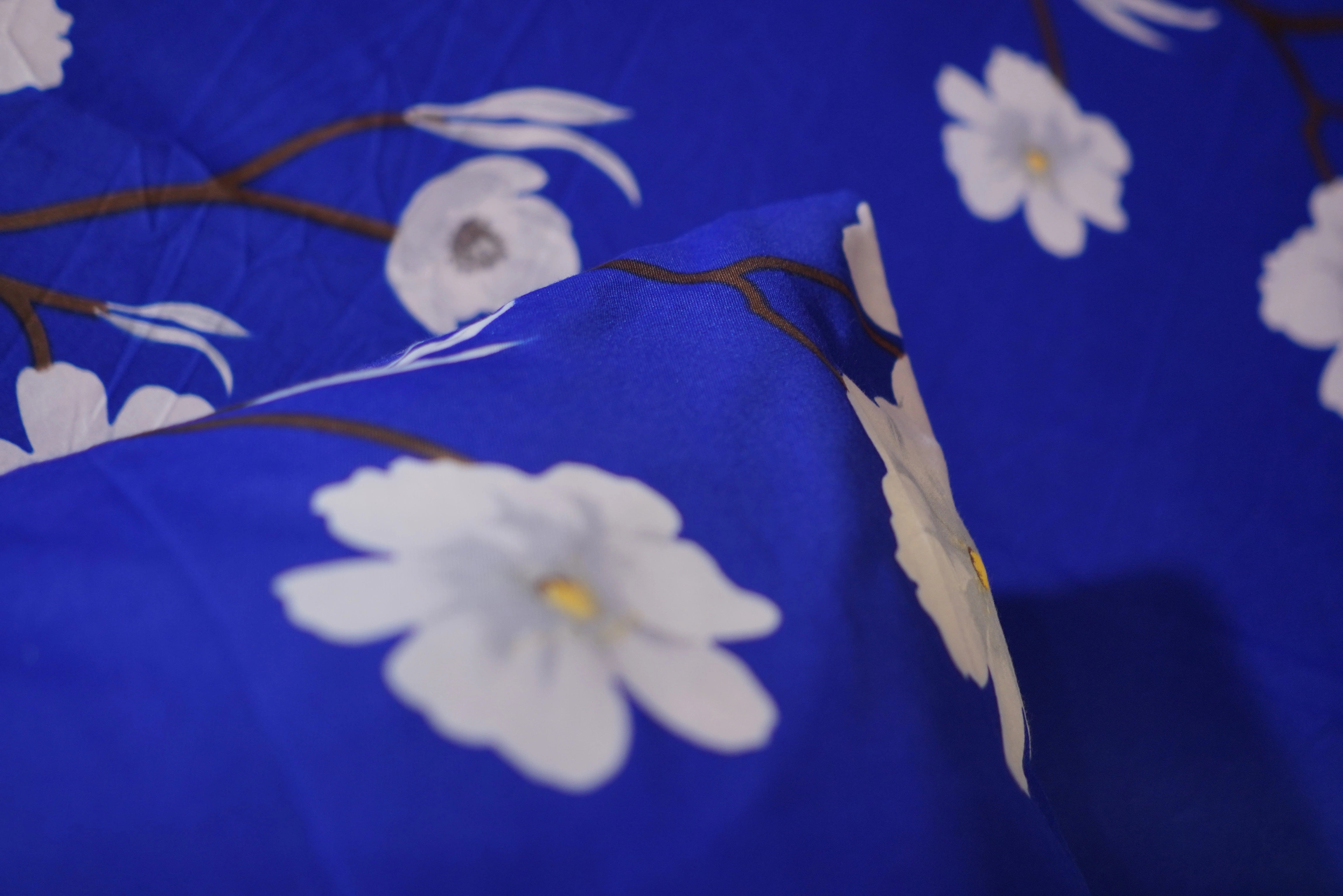 Blue fabric with white floral patterns
