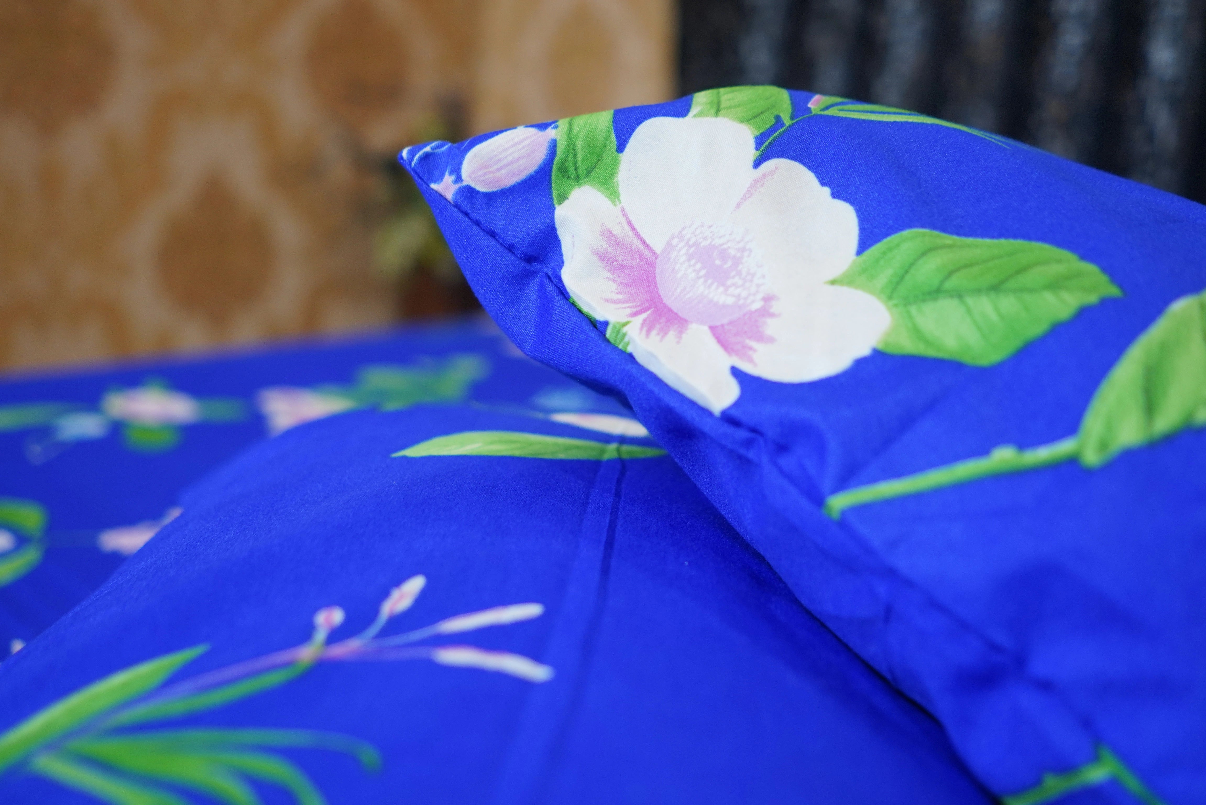 Blue fabric with floral design on a patterned background
