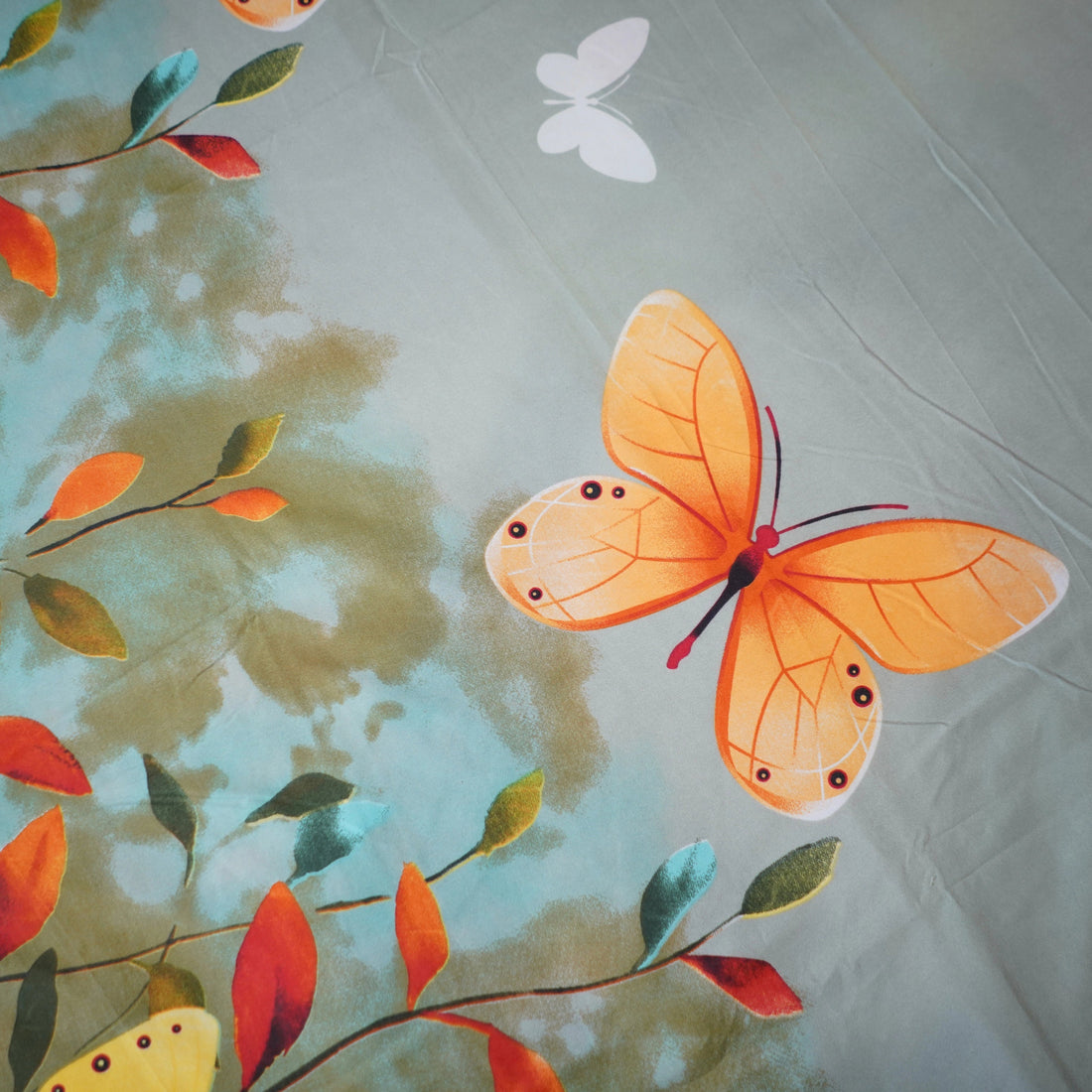 Bedding set with butterfly design in a bedroom setting
