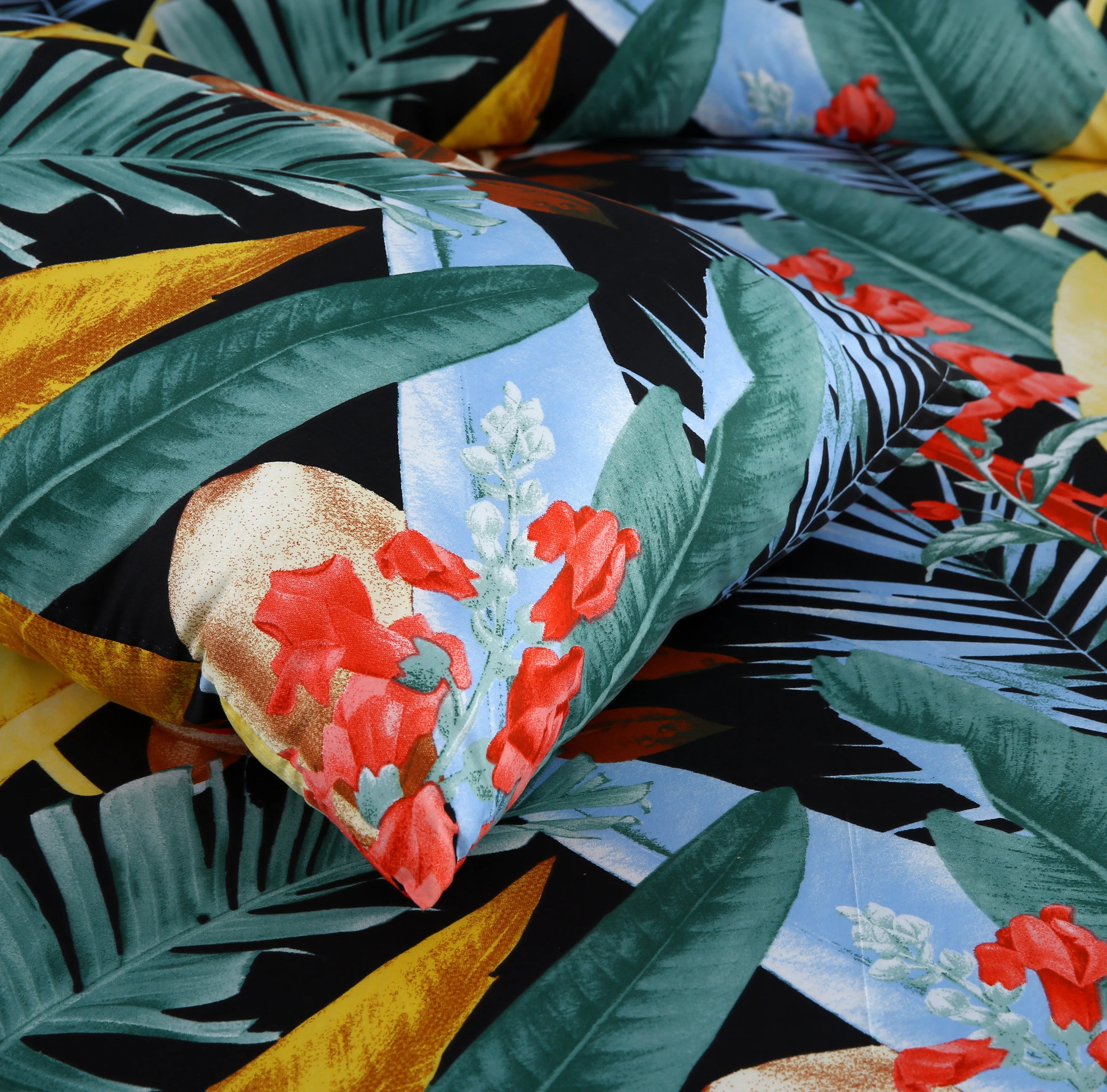 Tropical leaf and flower patterned fabric