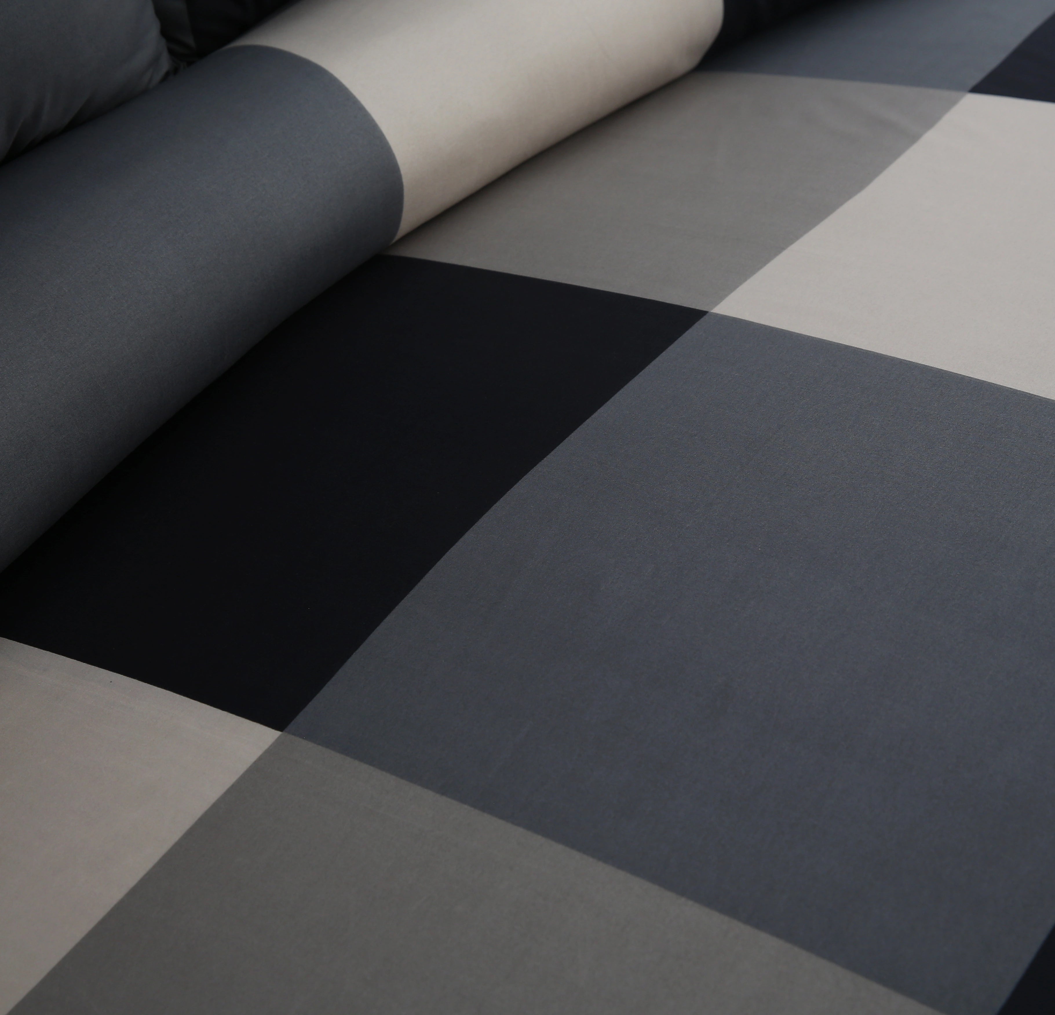 Roll of black and gray checkered fabric