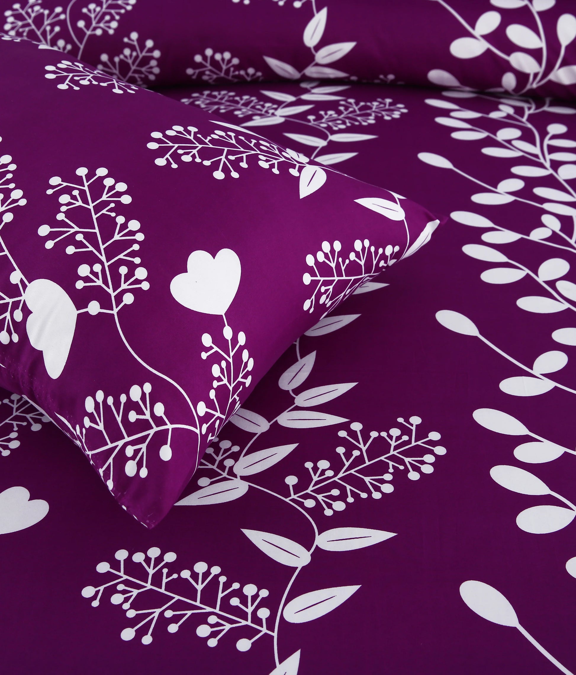 Purple bedding set with white floral patterns on a matching purple background