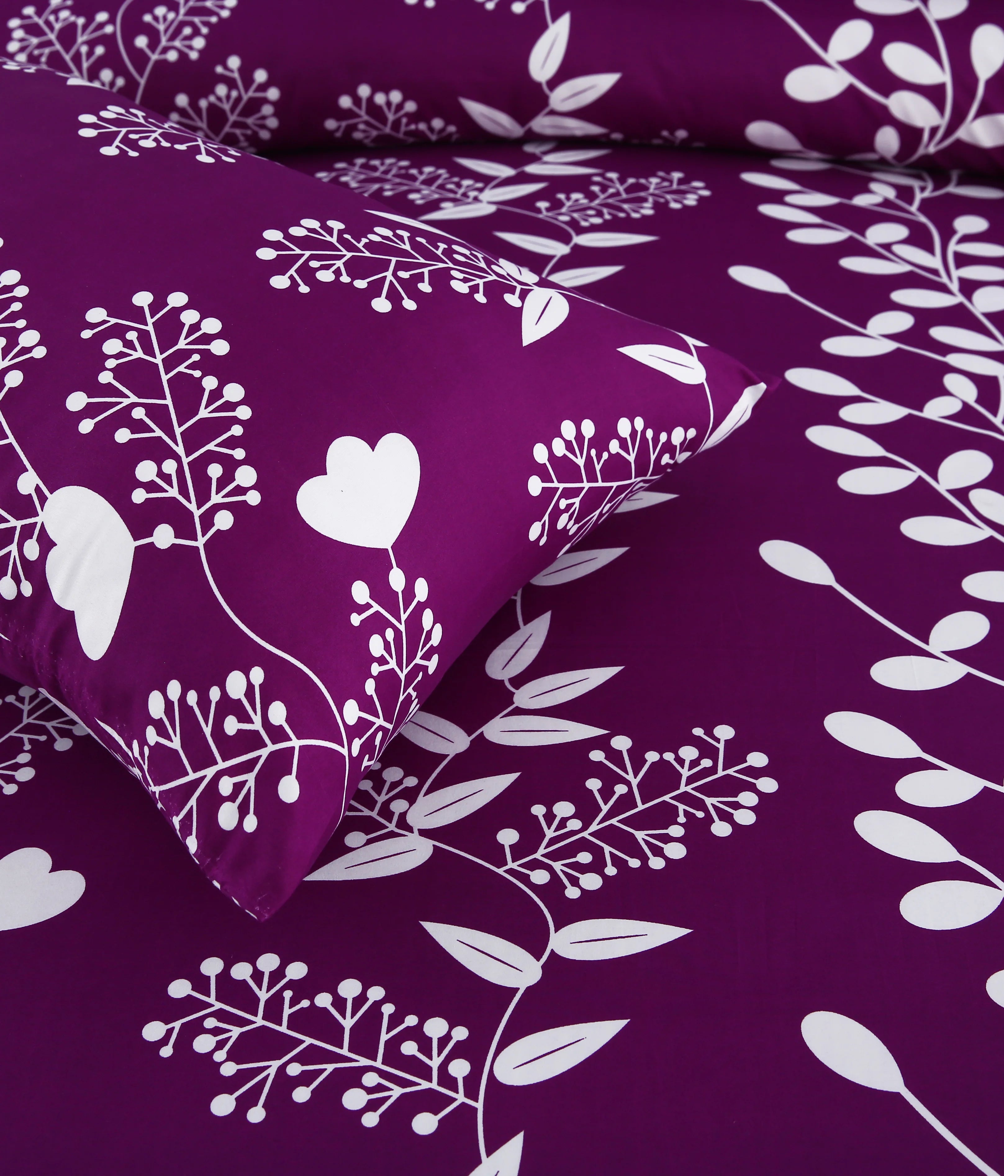 Purple bedding set with white floral patterns on a matching purple background