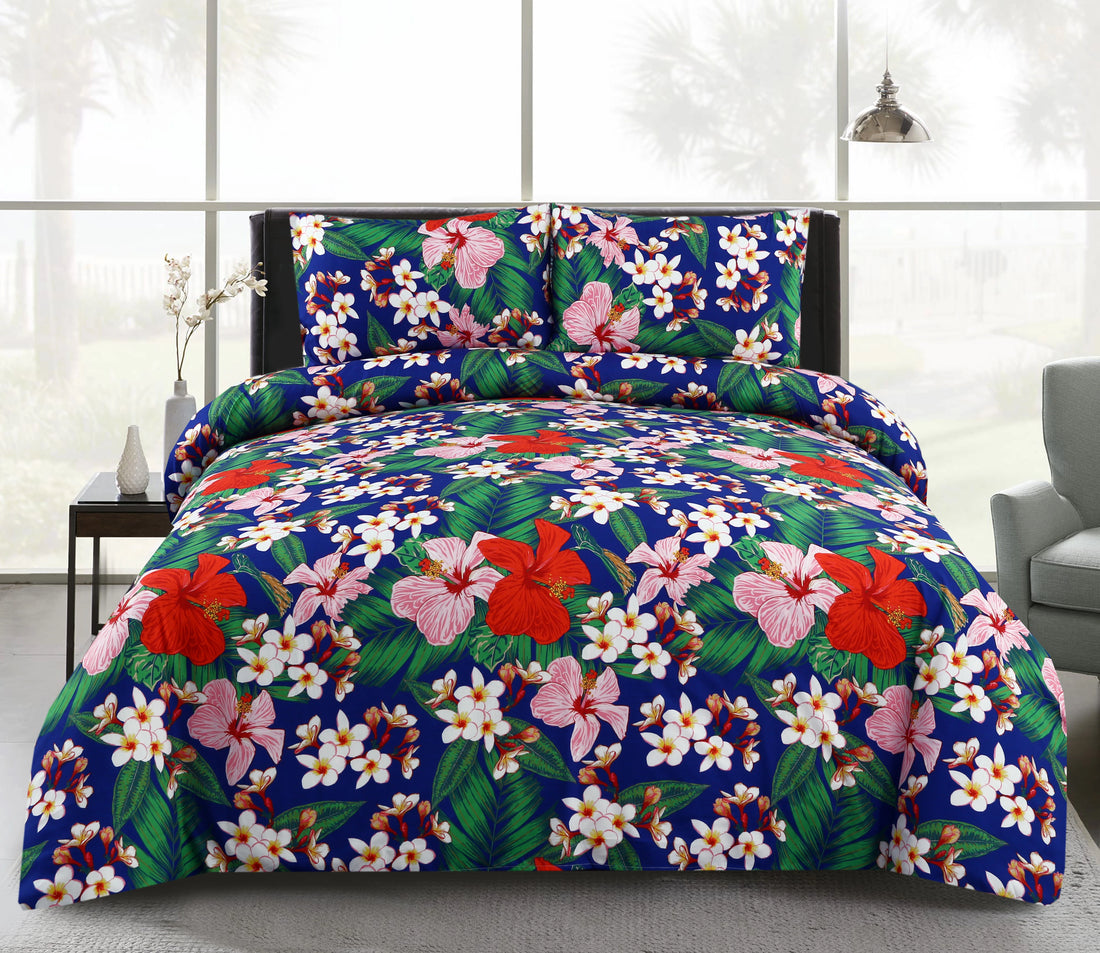 Floral bedding set on a bed in a room with a gray chair and white walls.