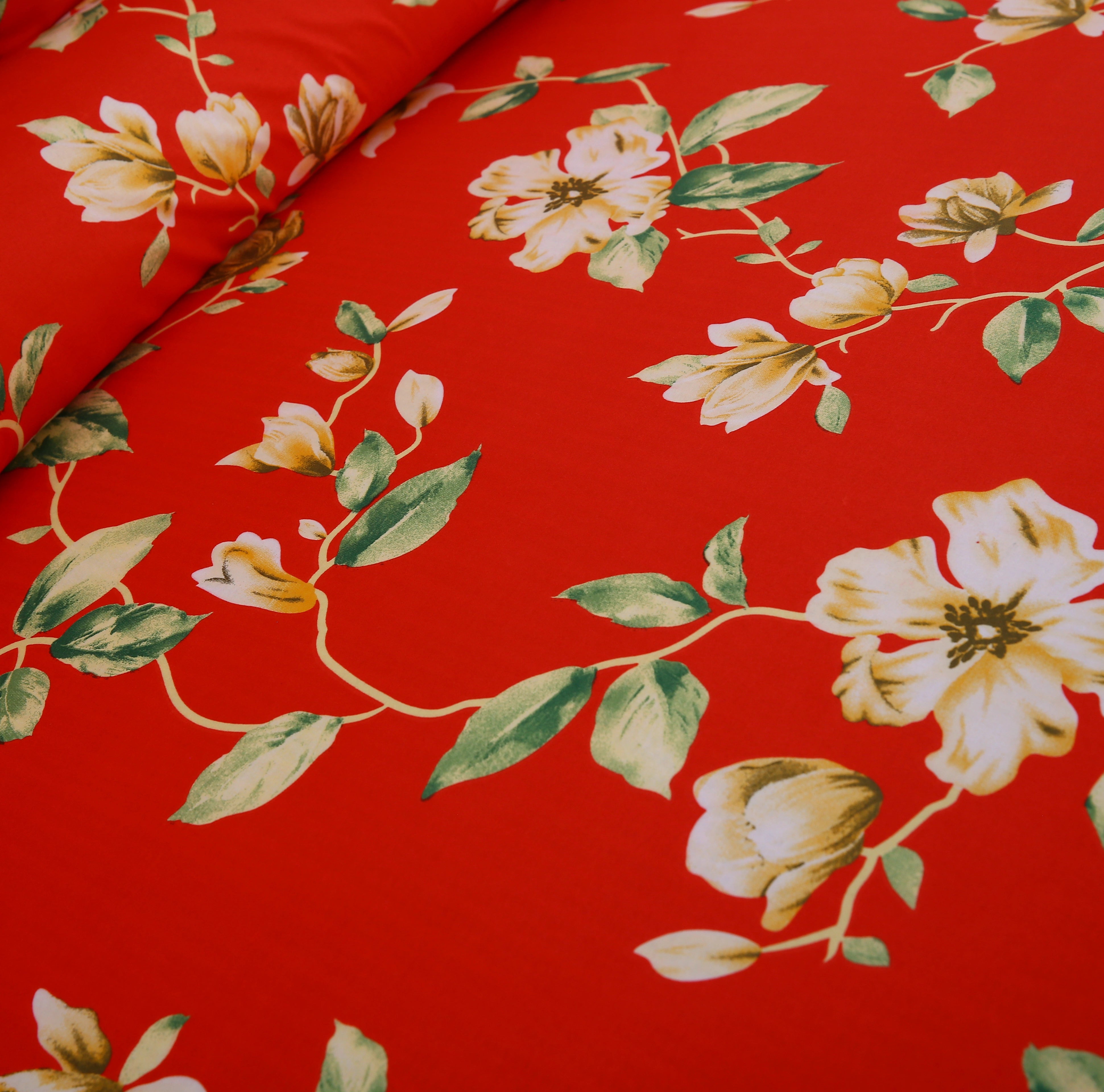 Floral pattern with white flowers and green leaves on a red background