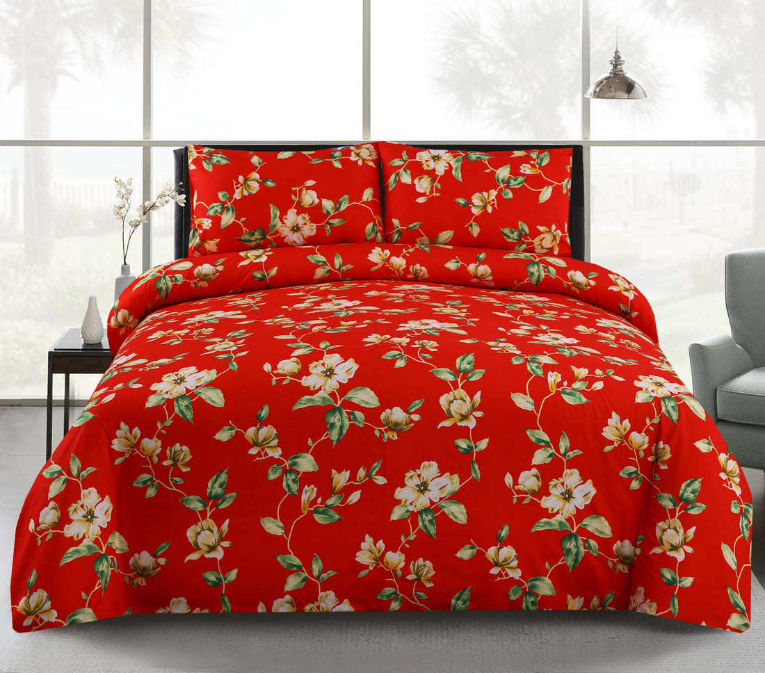 Red floral bedding set on a bed with a white background