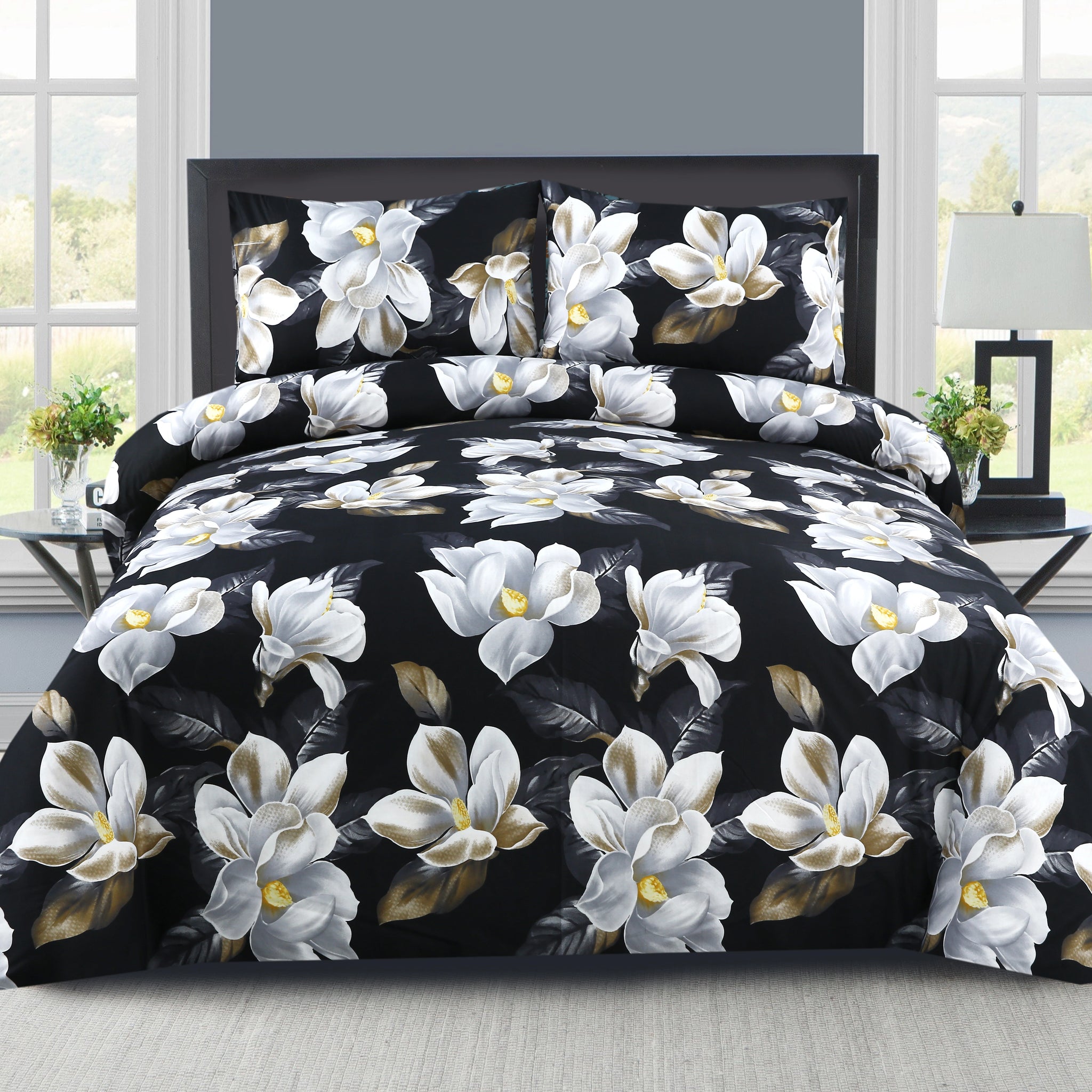Floral bedding set with white flowers on a black background in a bedroom setting.