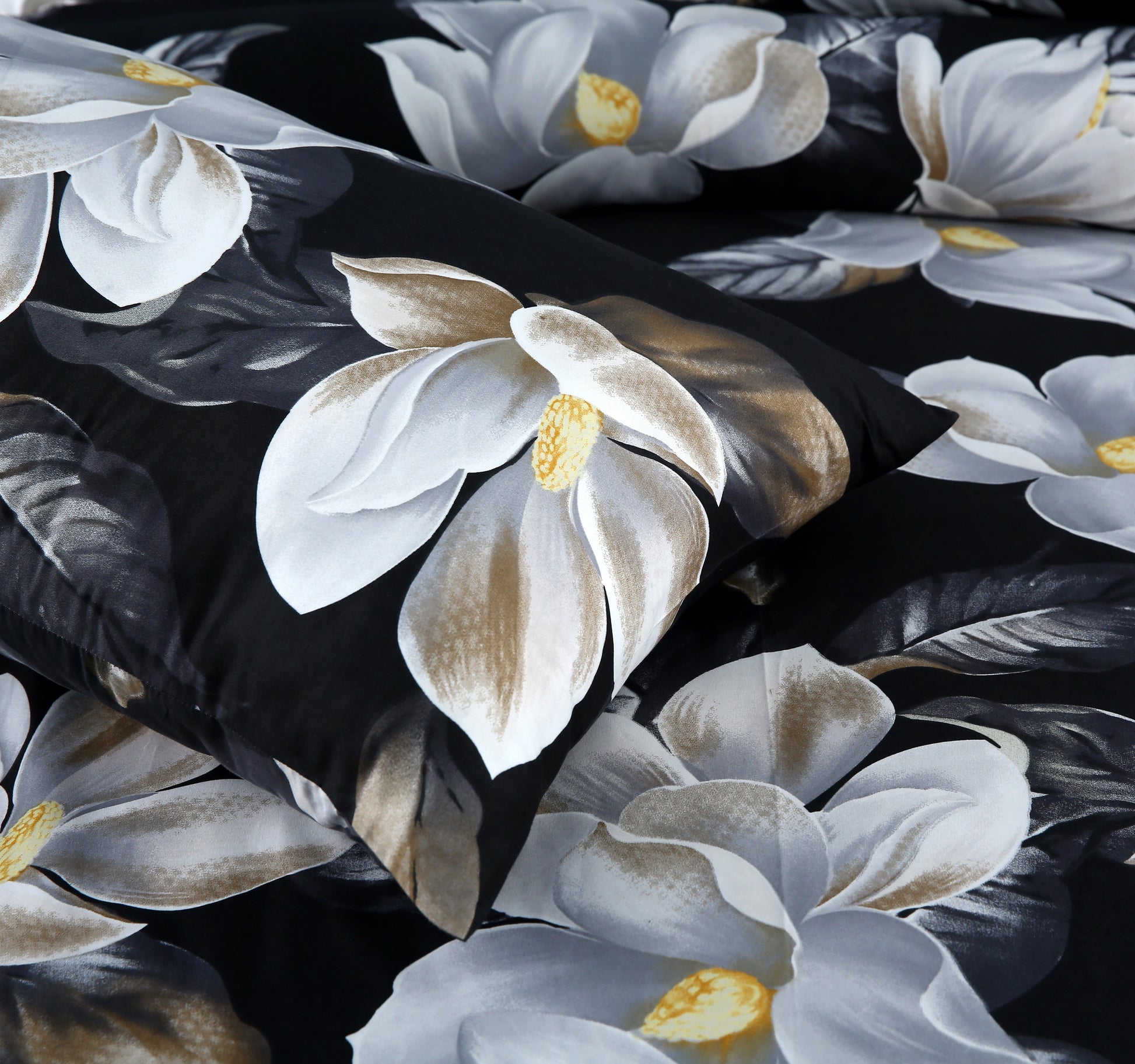 Floral patterned fabric with large white flowers on a black background