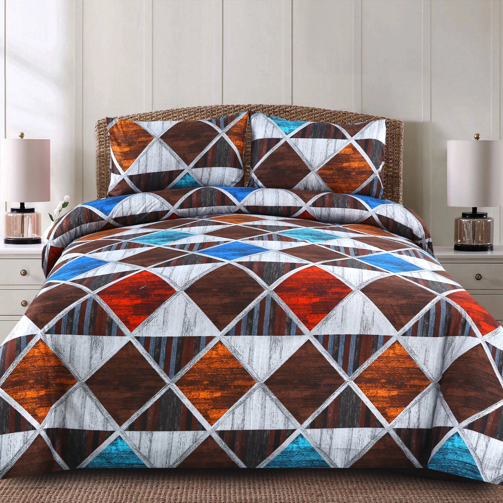Geometric patterned comforter set on a bed with matching pillows in a bedroom setting.