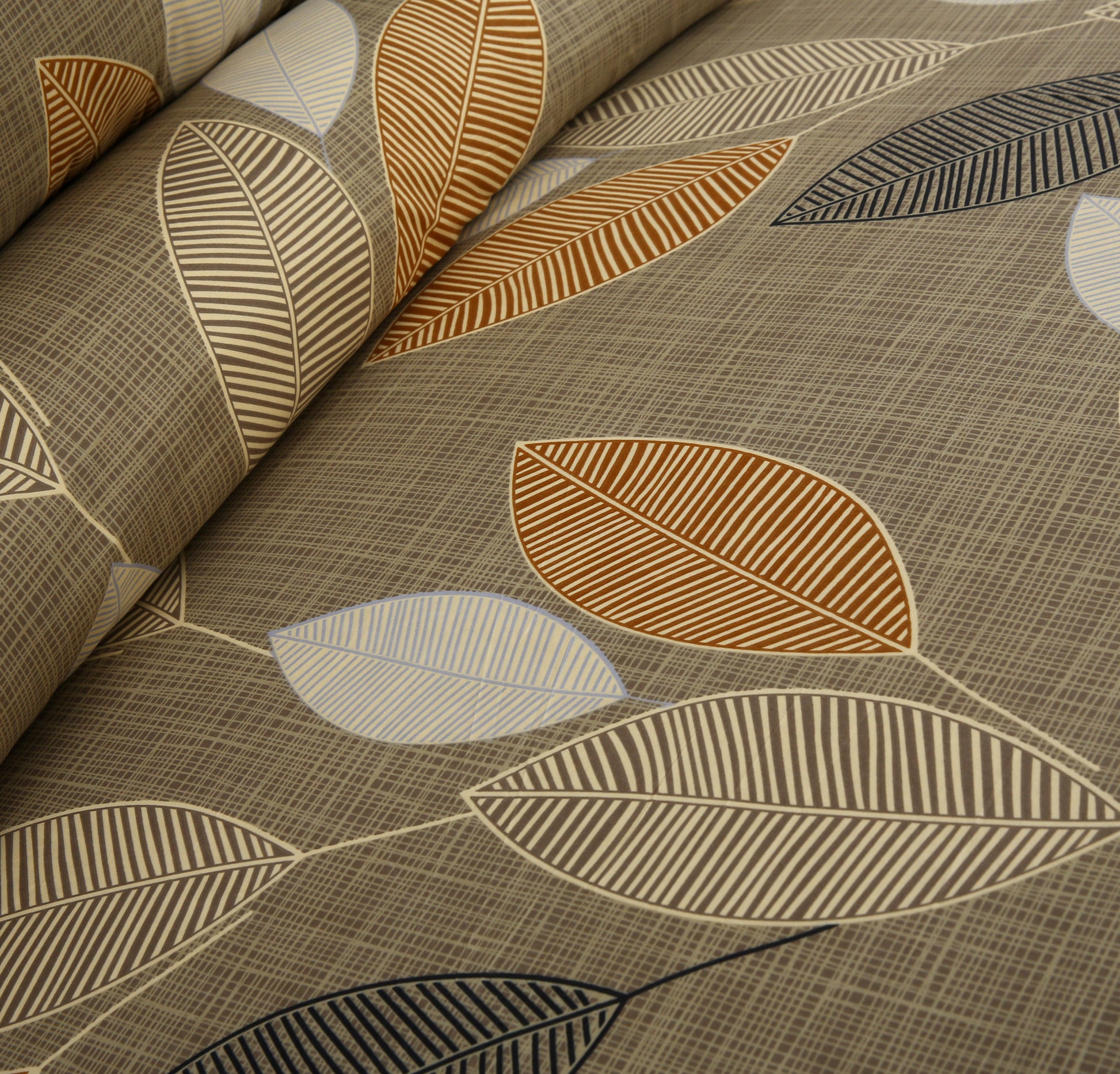 Textile with leaf pattern in brown, beige, and gray on a textured background
