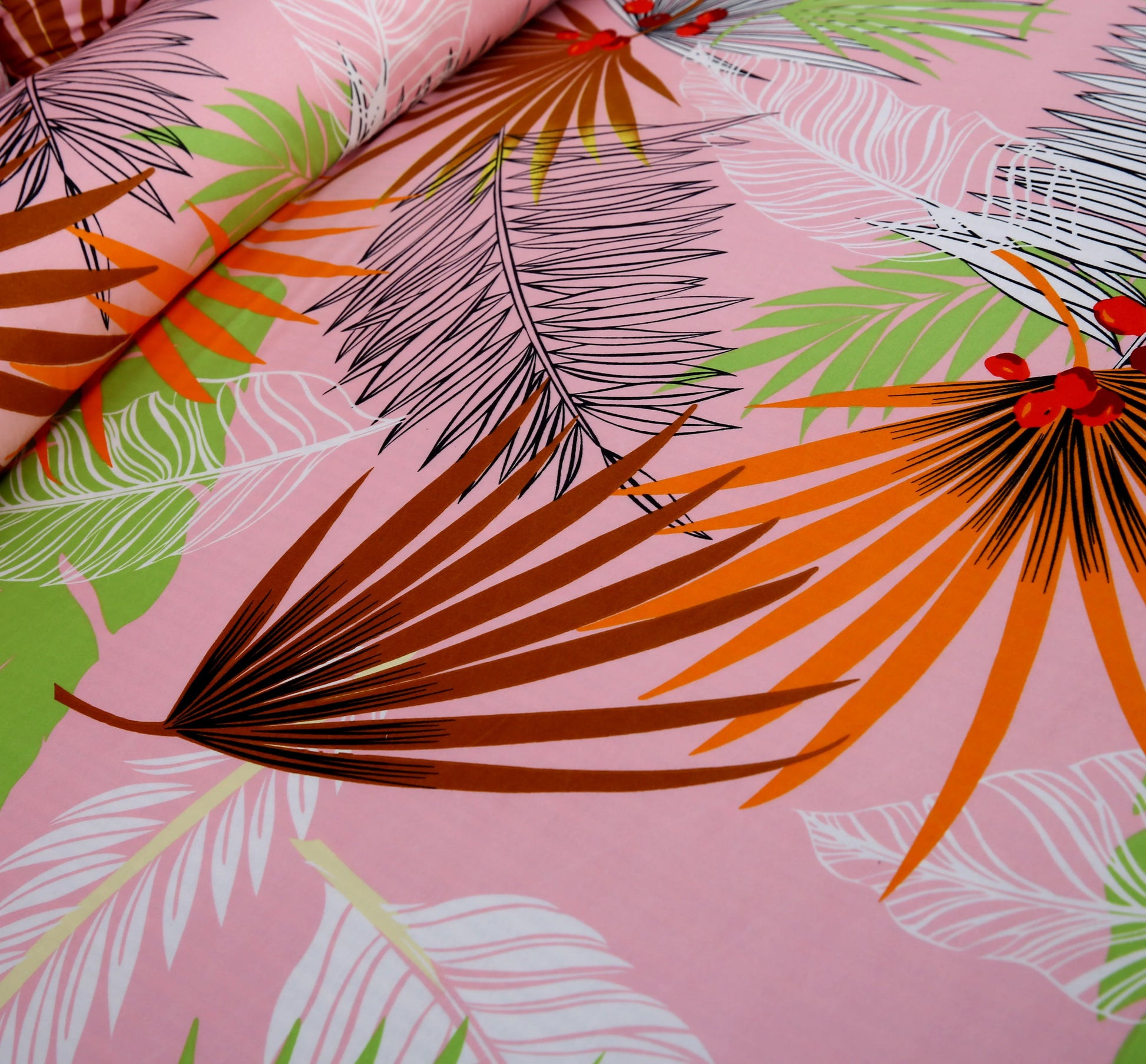 Tropical leaf pattern on a pink background