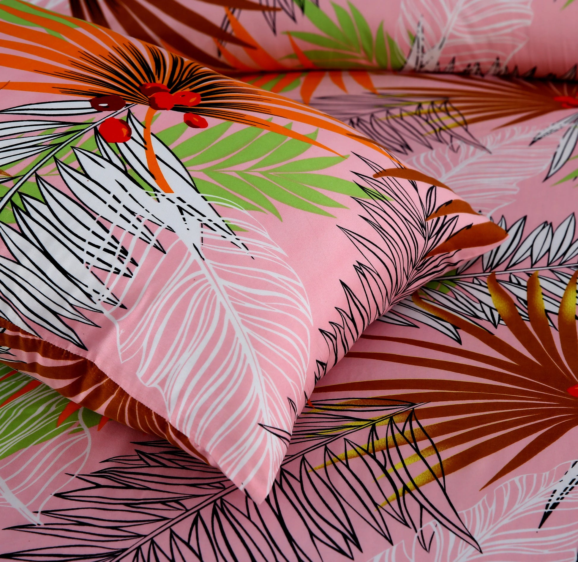 Fabric with tropical leaf pattern on a pink background