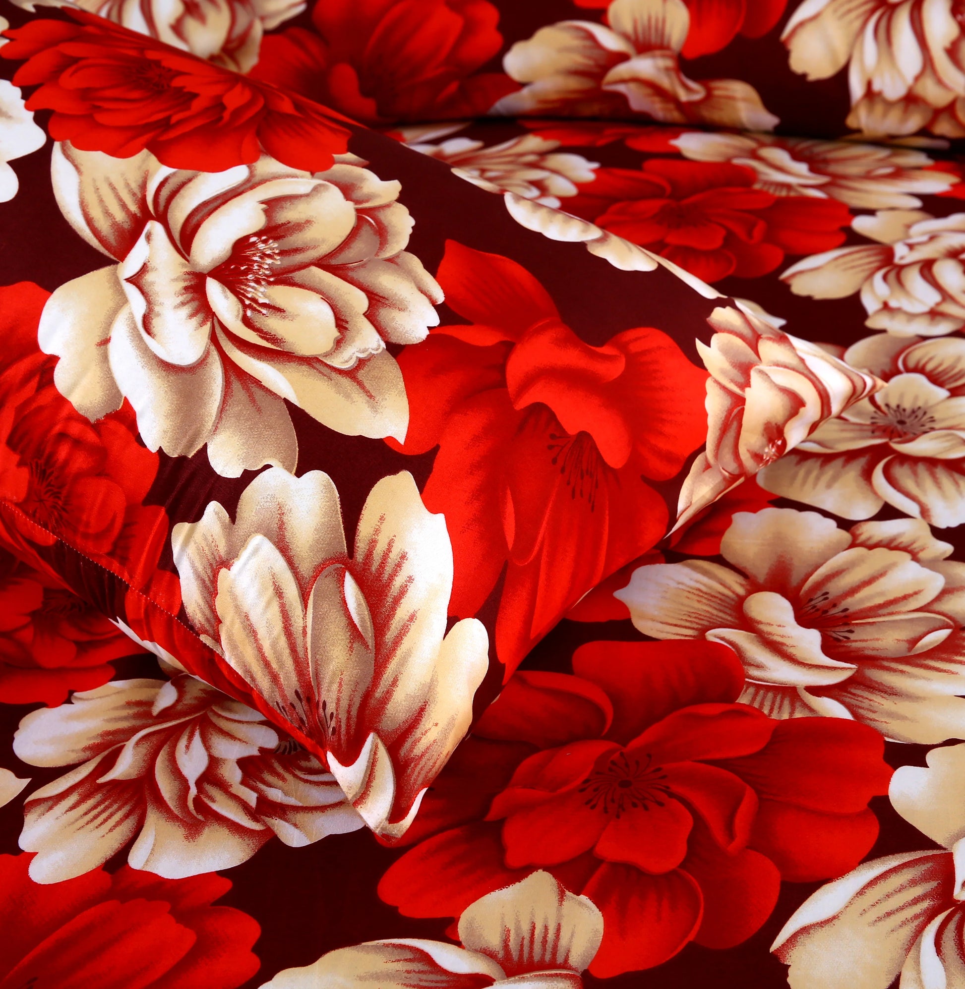 Close-up of a floral pattern with red and beige flowers on a dark background