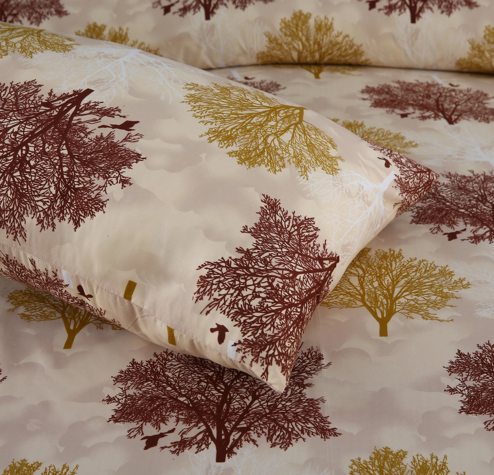 Pillowcases with tree pattern on a matching fabric background