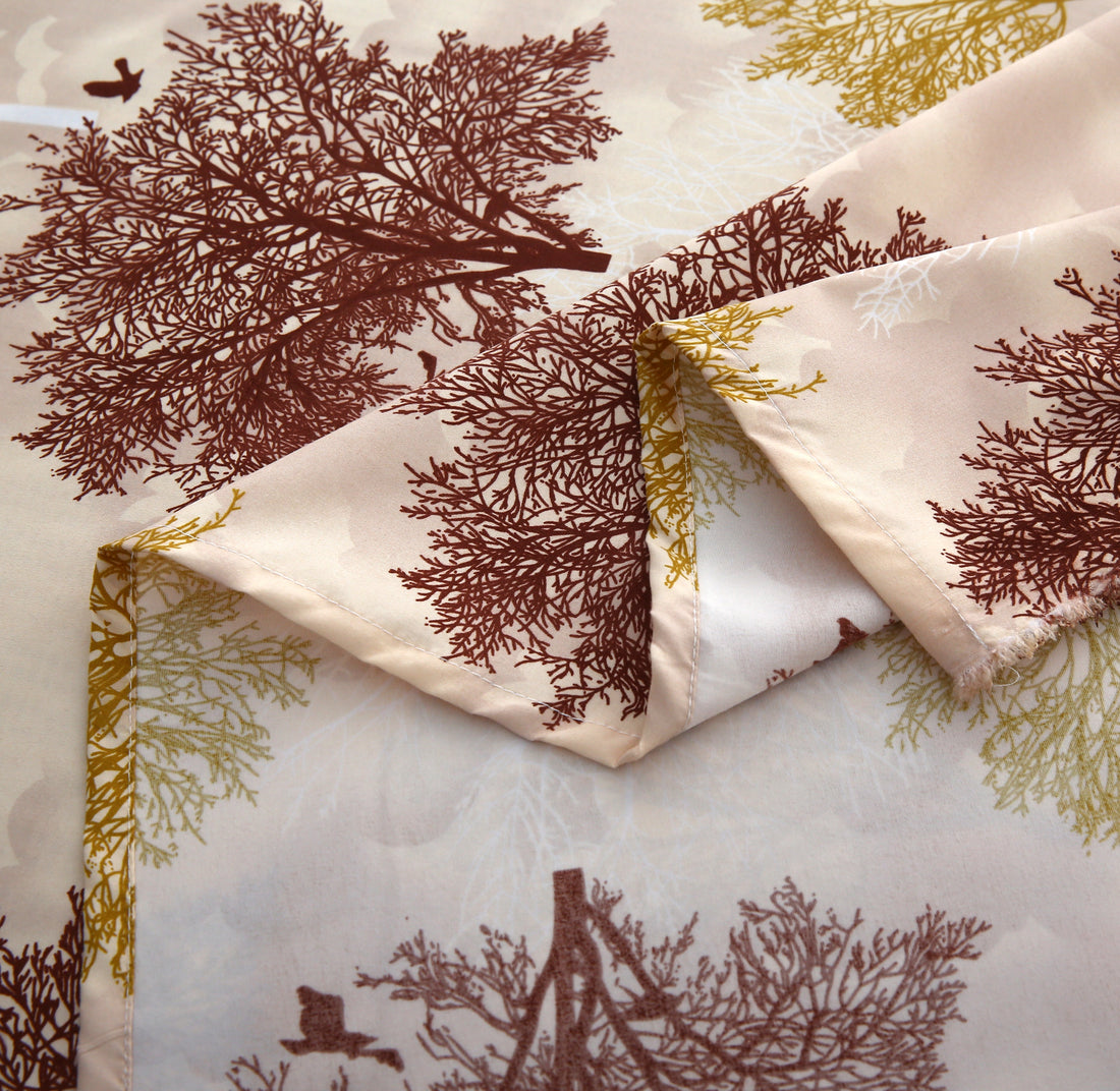 Bedding set with tree pattern in a bedroom setting