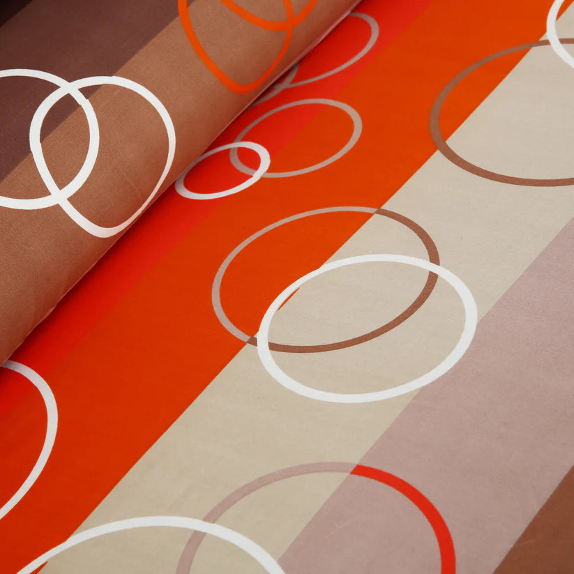 Bedding set with circular pattern in a bedroom setting