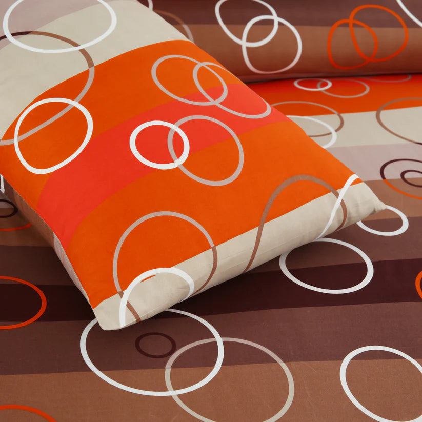 Decorative fabric with circular patterns in orange, brown, and white on a brown background.